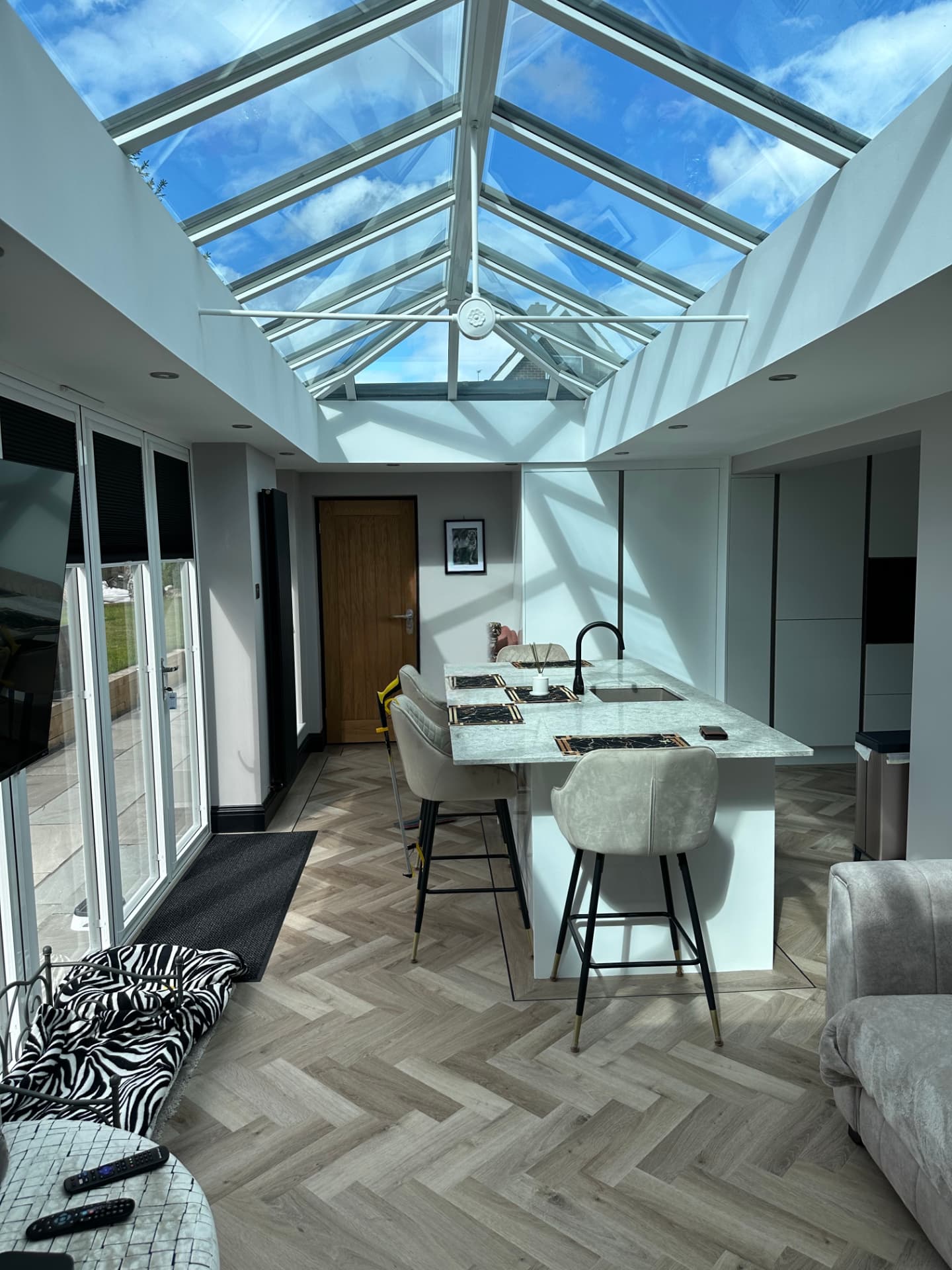 Kitchen and dining space beneath a pitched glass roof lantern, Shotton Colliery