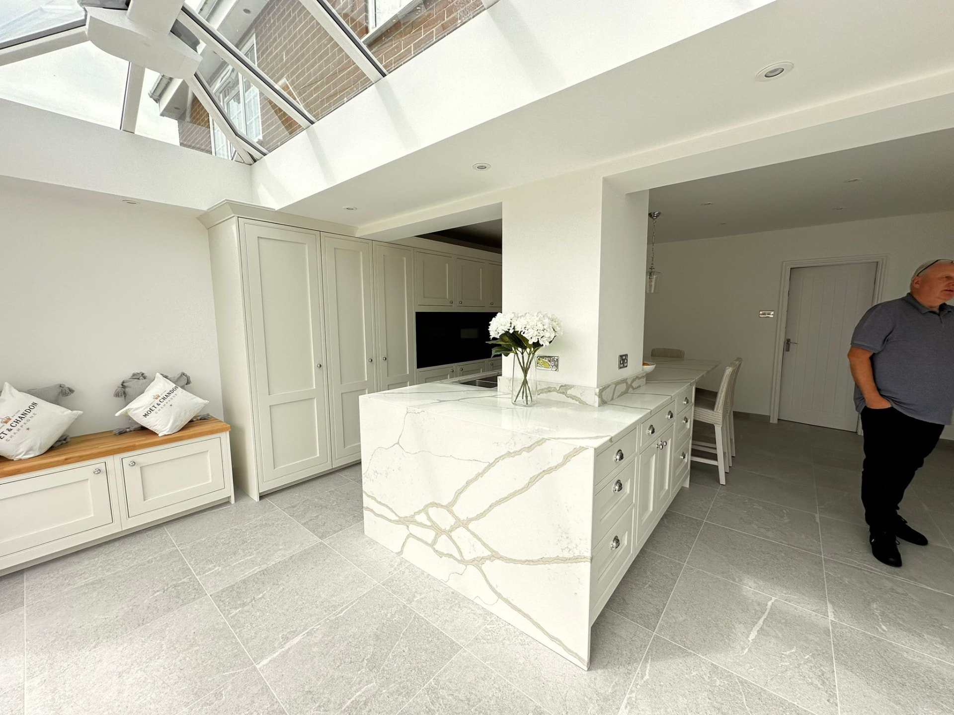 Orangery kitchen extension in Silksworth with glazed roof lantern and veined quartz island