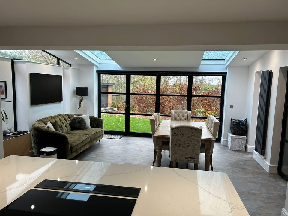 Open-plan living and dining extension in Wynyard with roof lanterns and black bifold doors to the garden