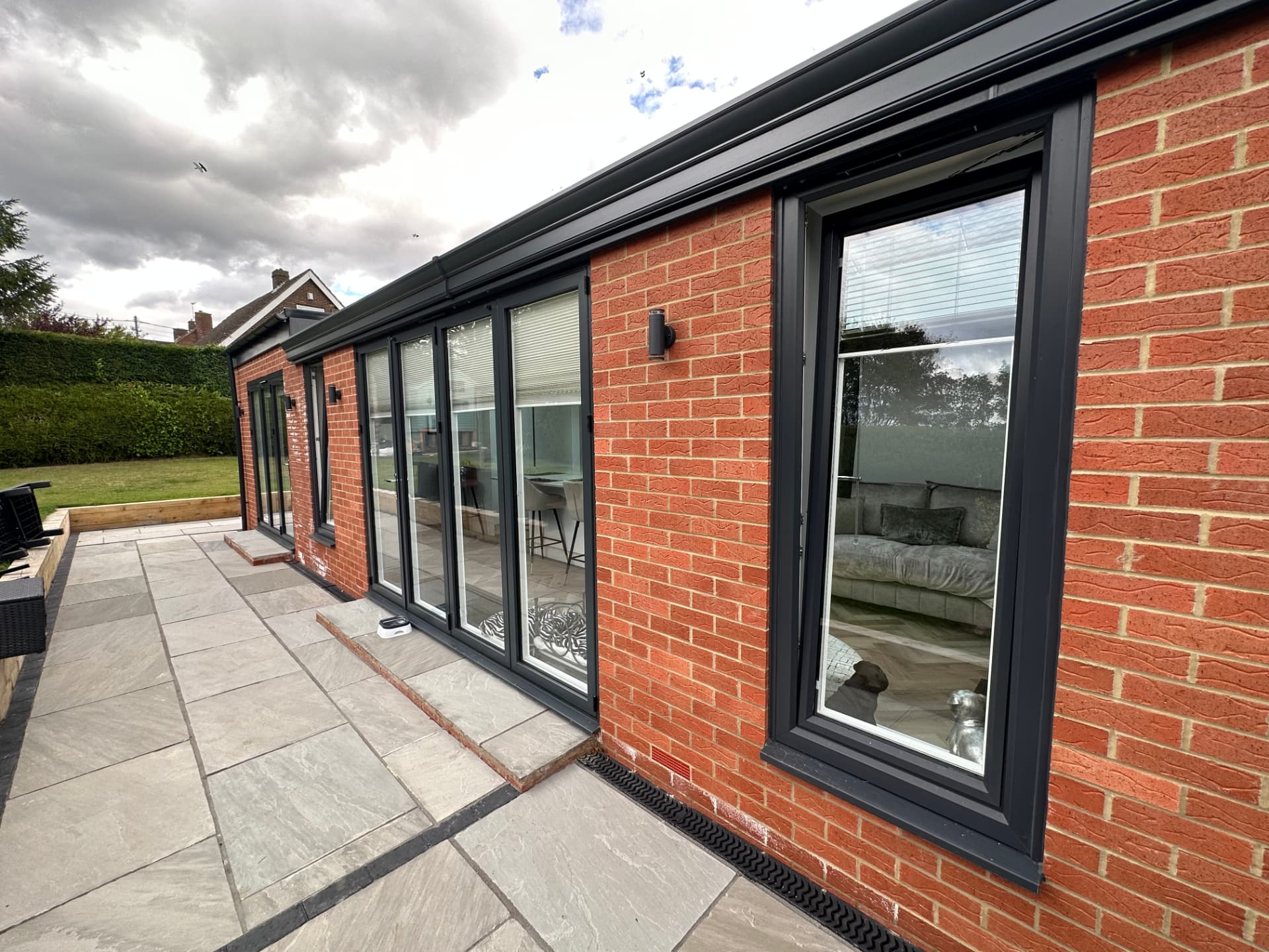Paved terrace and full-height glazing of the Shotton Colliery orangery