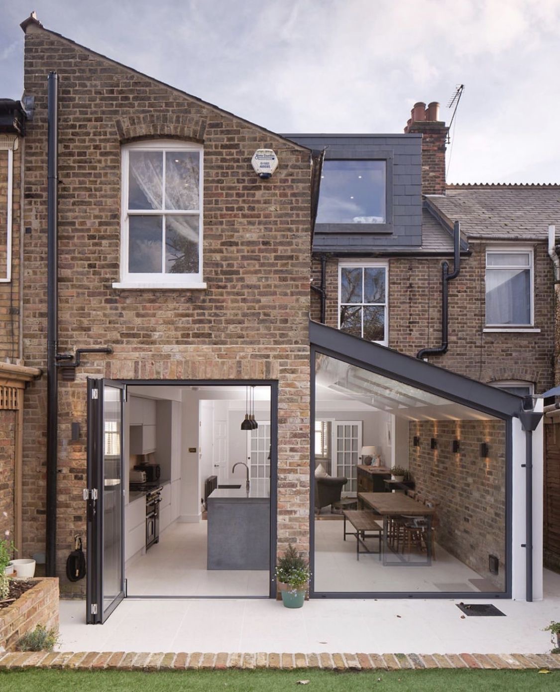 Rear kitchen extension with full-width glazing open to the garden at The Smiths' home in Jesmond