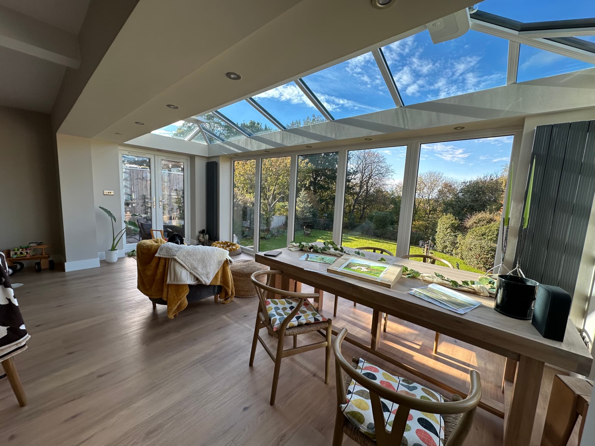 Open-plan dining space beneath a full-width glazed lantern roof