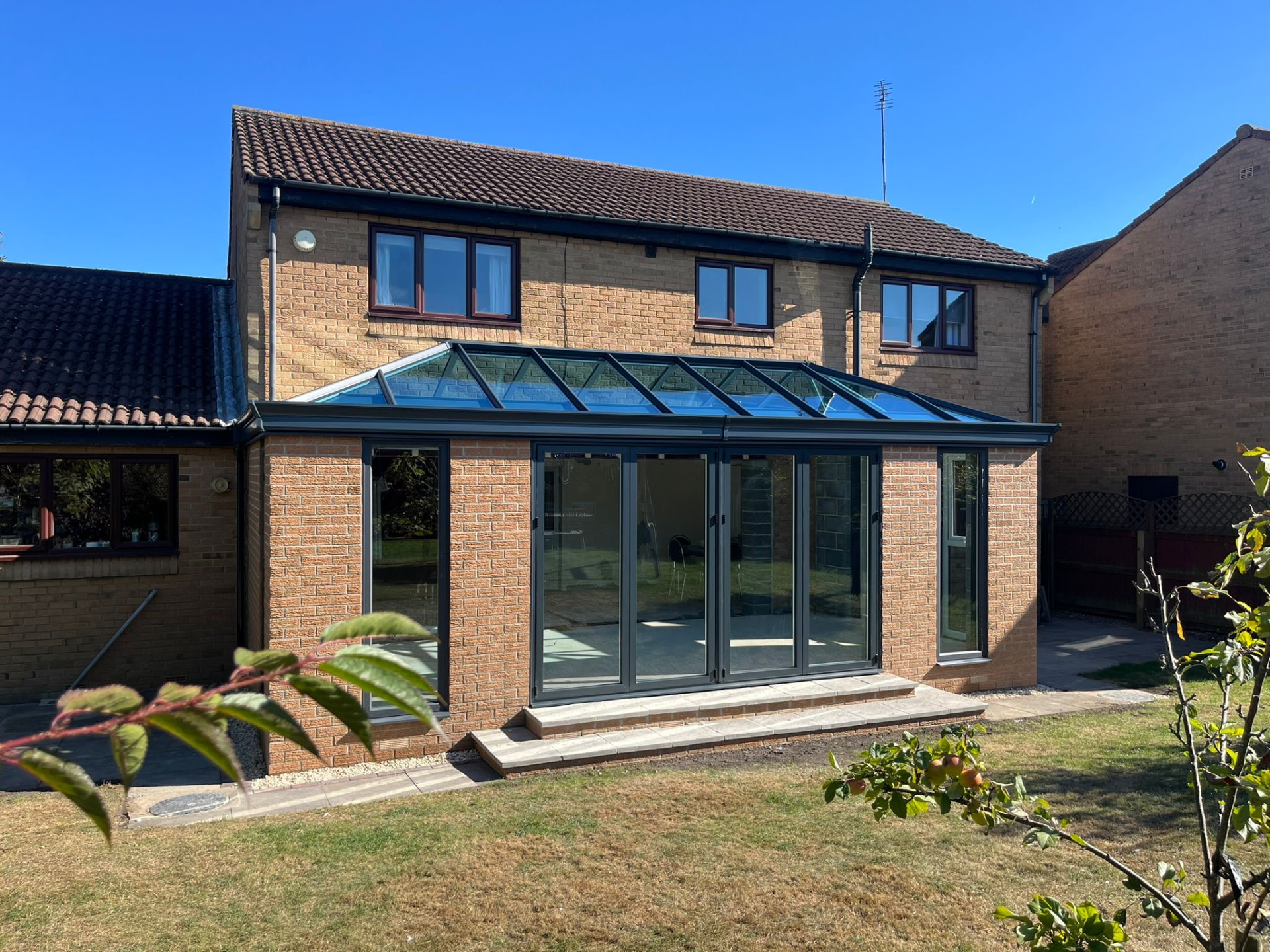 The Hayon’s brick kitchen extension in Langley Park with a glazed roof and anthracite garden doors