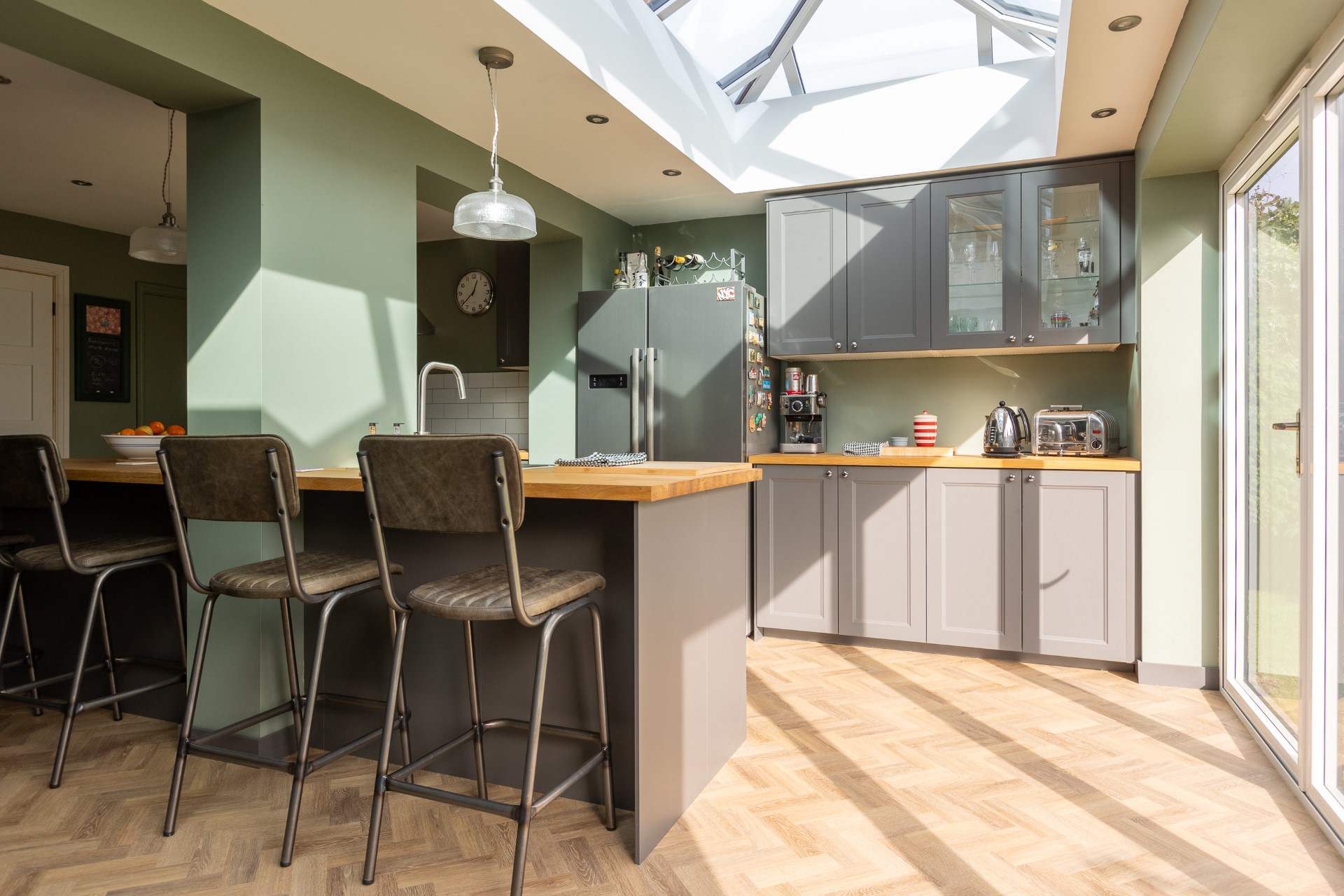 Shaker kitchen with oak worktops and sage walls in Sunderland