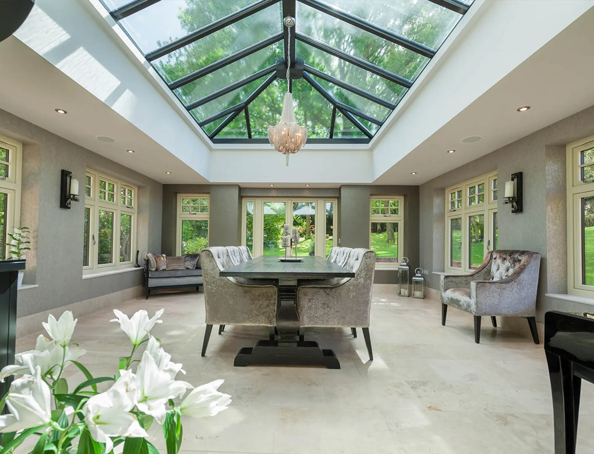 Formal dining orangery interior beneath a glass roof lantern, Stanhope