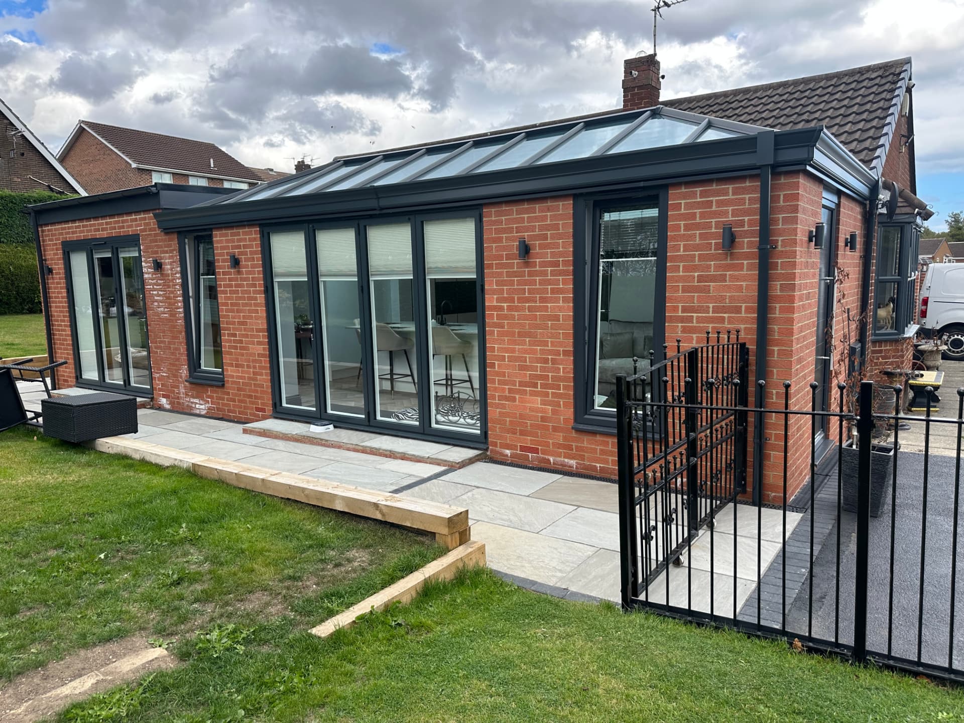 Contemporary brick orangery extension in Shotton Colliery with anthracite bi-folding doors and a glass roof lantern by Alpine Extensions