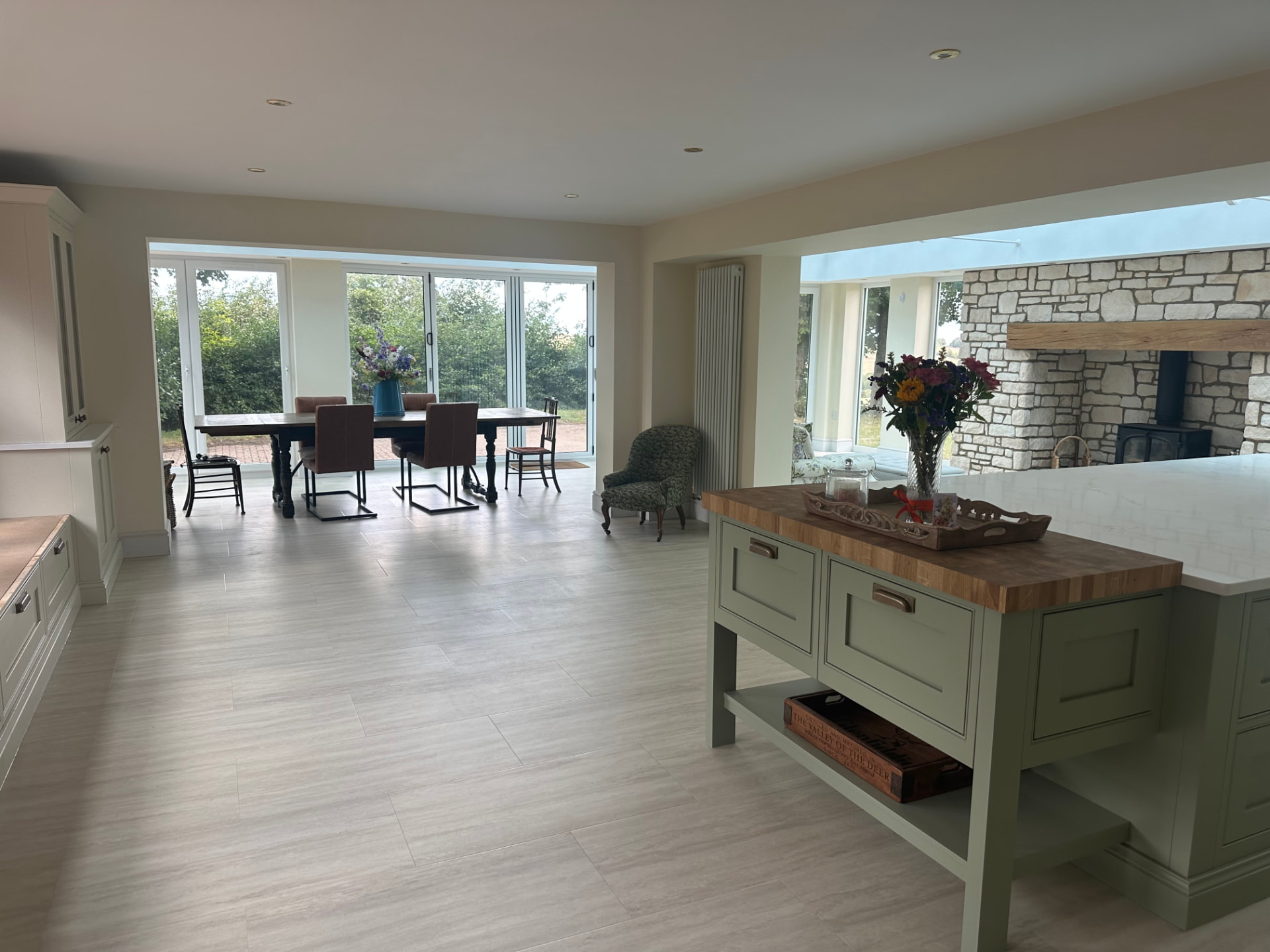 Open-plan kitchen, dining and living space with bifold doors to the garden