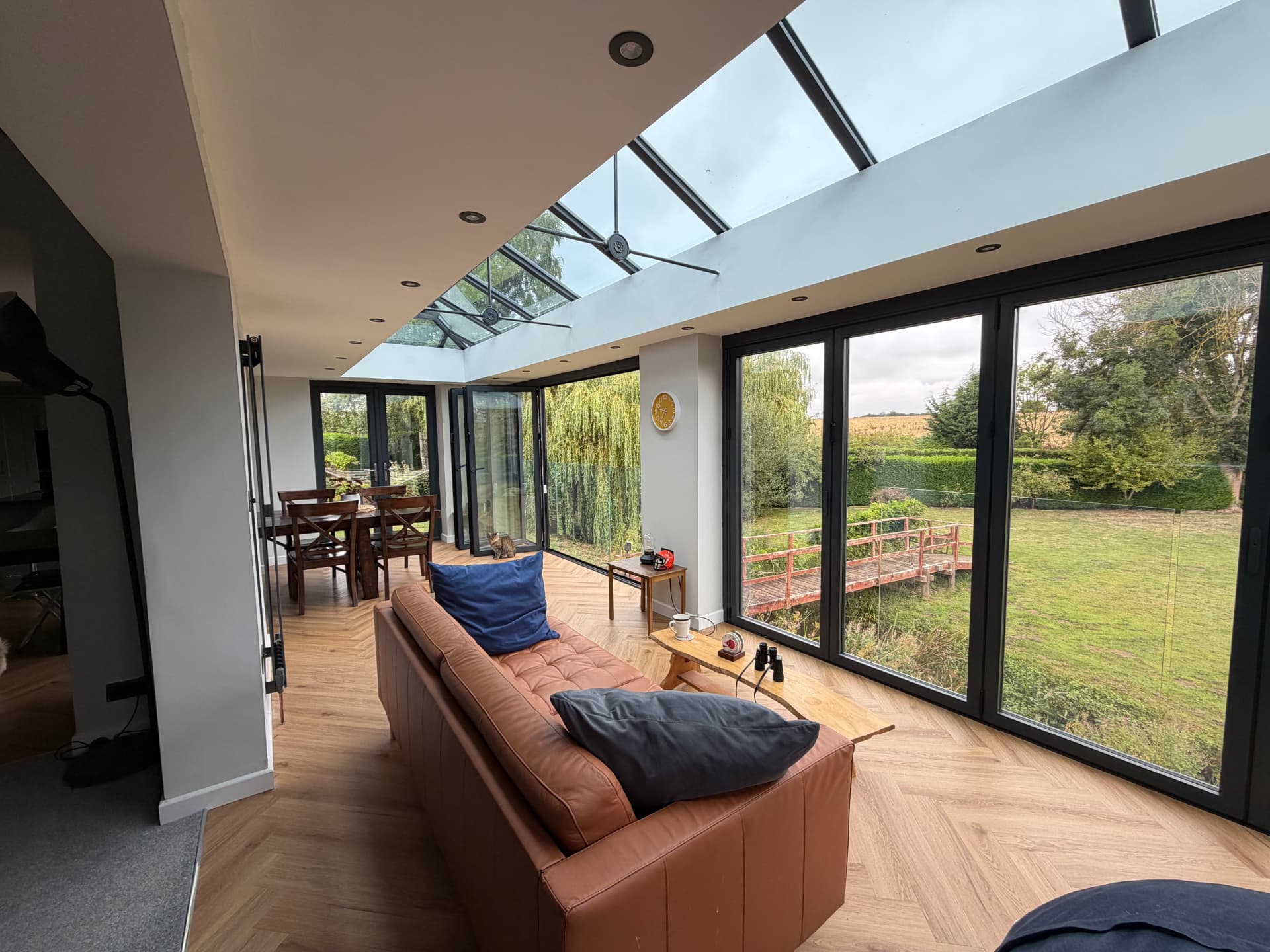 Open-plan living space under the lantern roof overlooking the garden