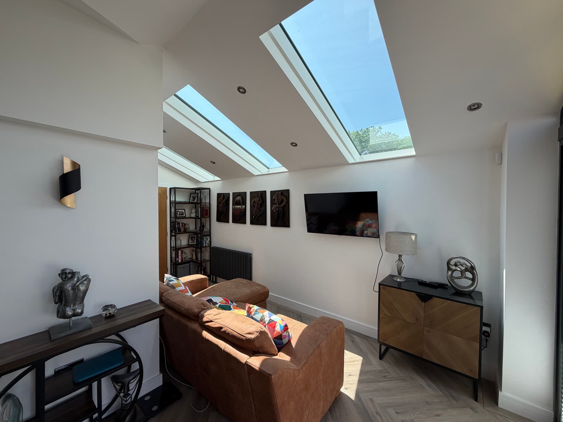 Bright living area beneath twin slimline roof lights
