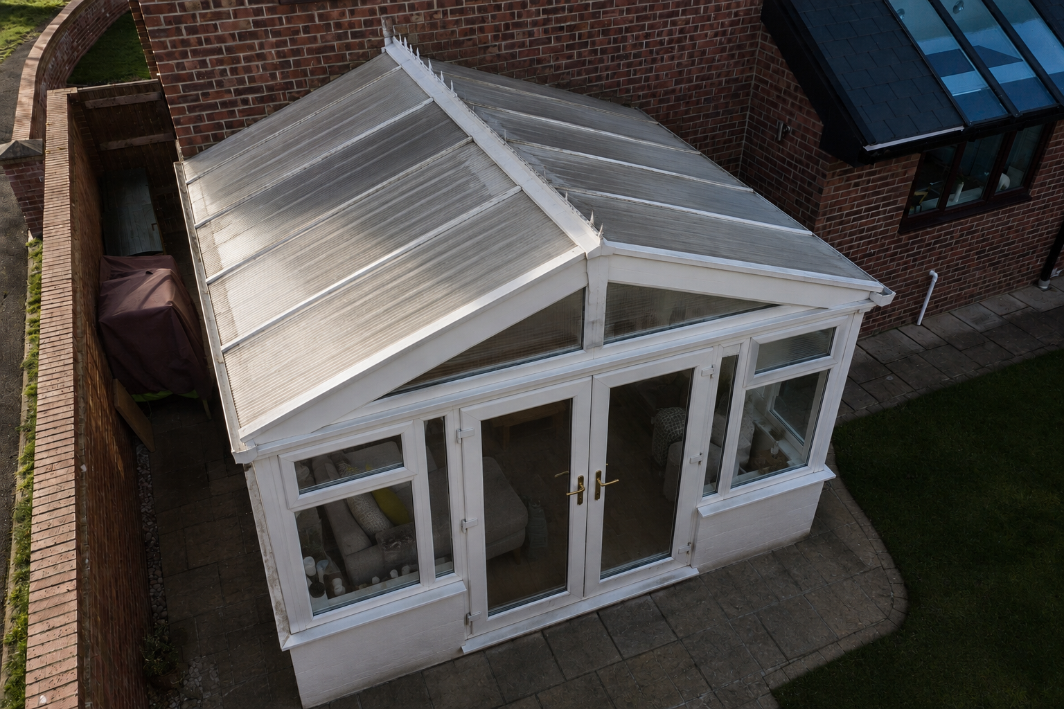 Dated white uPVC conservatory before replacement