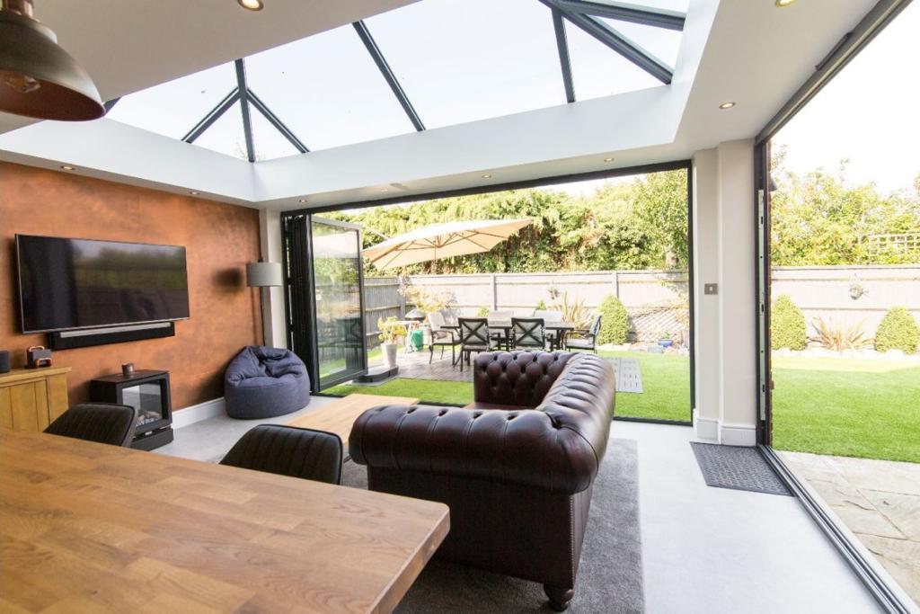 modern orangery with bifolding doors open